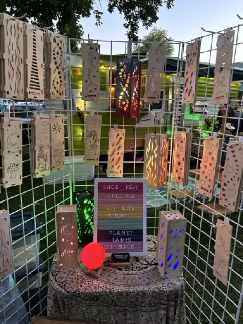 BamboozLED vendor booth featuring illuminated bamboo lanterns at Shoe Fest.
