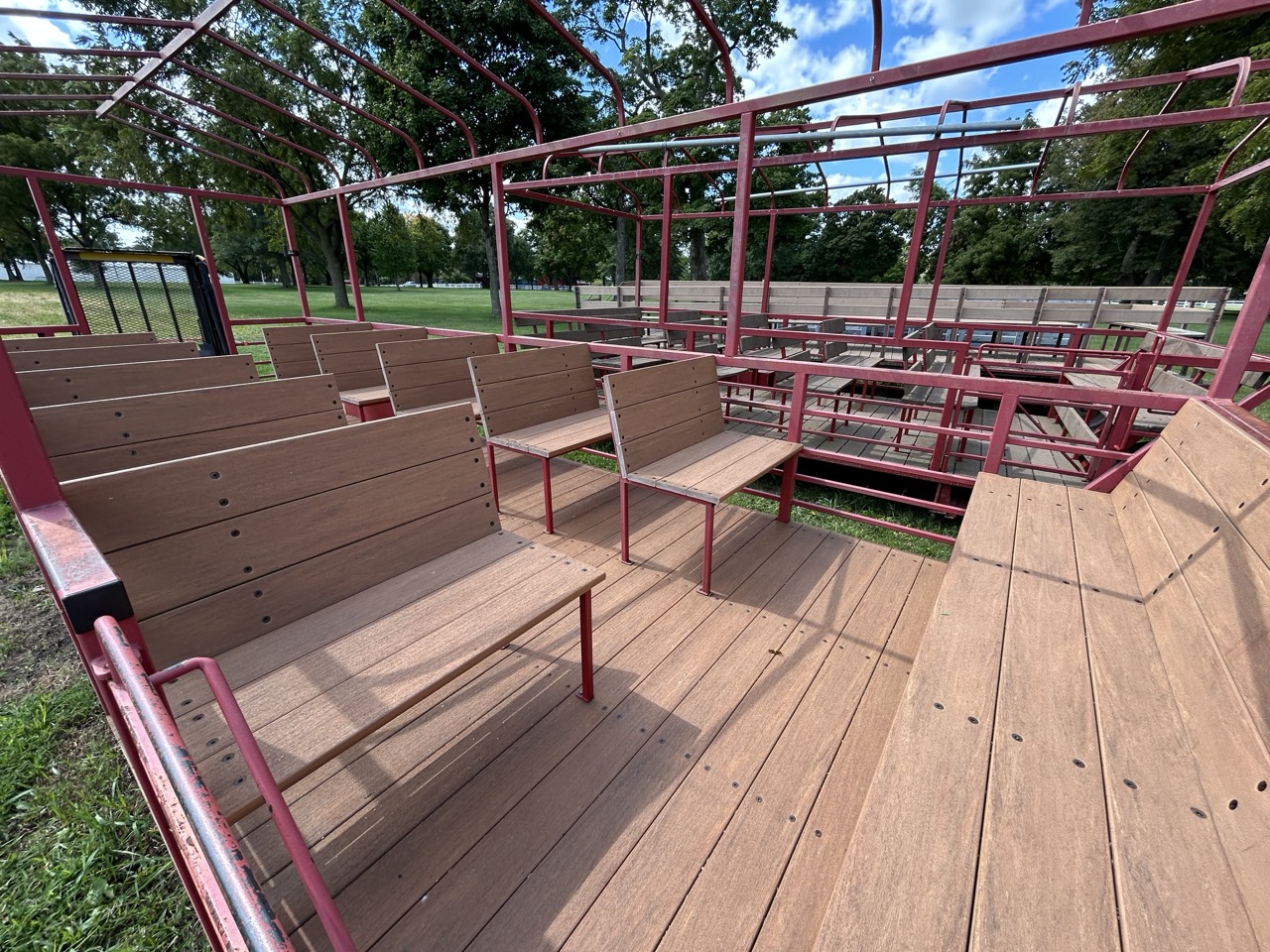Hayrack wagon with benches at Perry Farm, set up for public seating during a tractor-pulled ride.