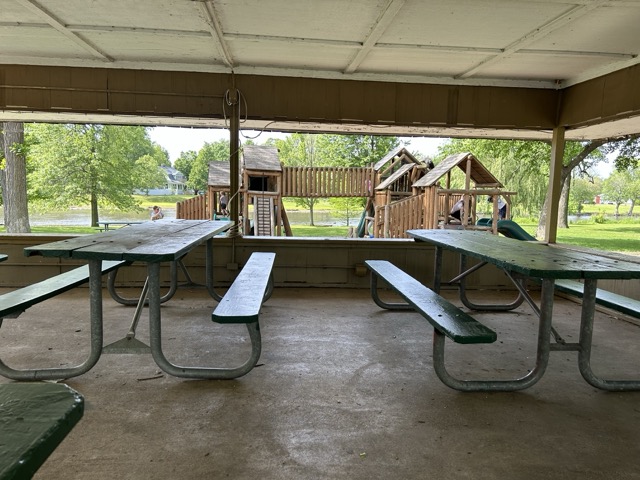 Images of Island Park in Momence, IL show slides, the river, and a pedestrian bridge.