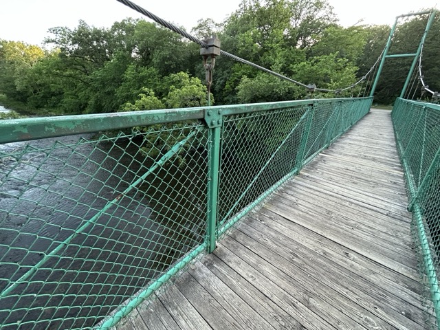 The extension bridge at the Kankakee River State Park goes over Rock Creek and connects two halves of the same trail.
